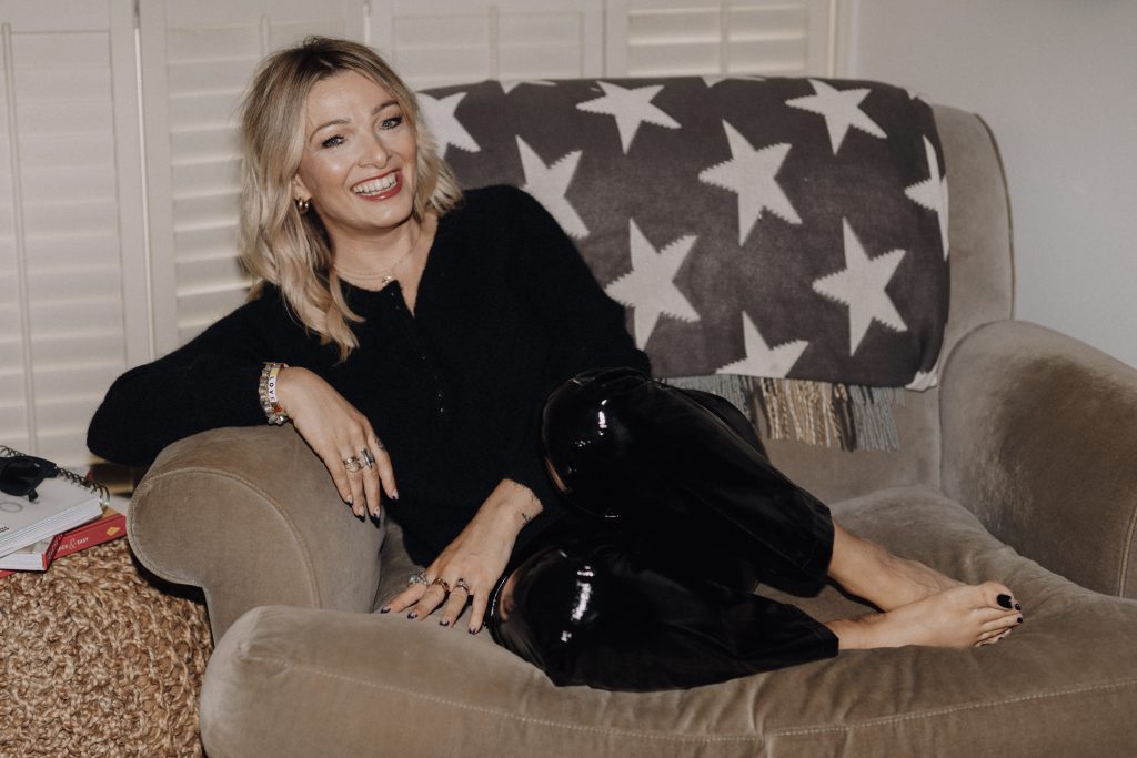 Jo Irving sitting on sofa